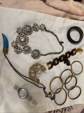 Assorted used costume jewelry grab bag.
